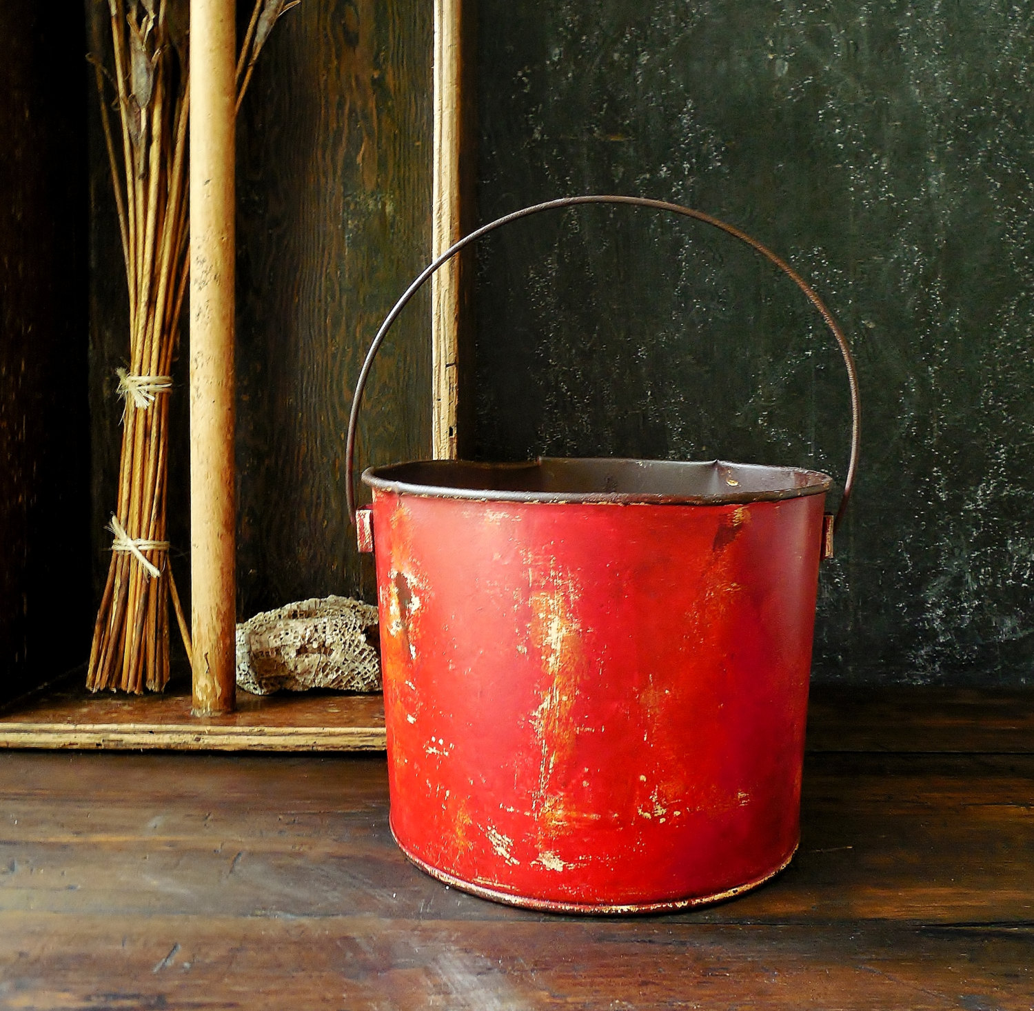 old red farm bucket