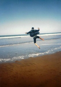 Kev leaping on beach