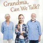 Grandparents-standing-looking-at-grandaughter